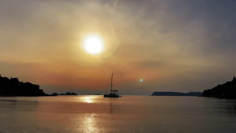Sailboat At Sunset 스톡 동영상 174821624