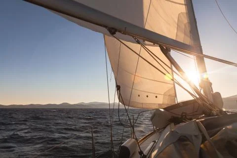 Sailboat at sunset ocean Foto stock