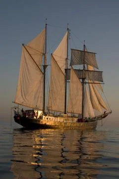 Sailboat at sunset Stock Photos
