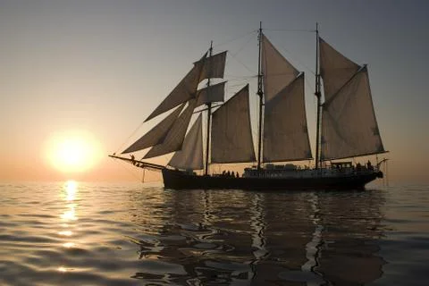 Sailboat at sunset Stock Photos