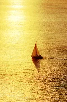 Sailboat at sunset Stock Photos