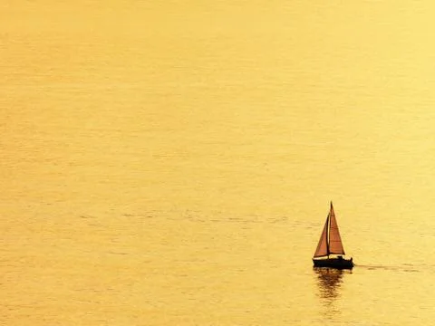 Sailboat at sunset Stock Photos