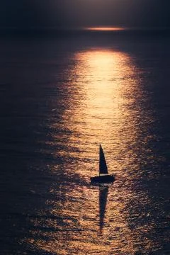Sailboat at sunset Stock Photos
