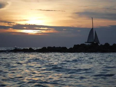 Sailboat at sunset Stock Photos
