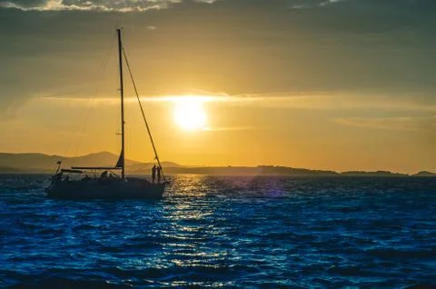Sailboat by sunset Stock Photos