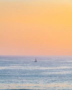 A Sailboat at Sunset Stock Photos