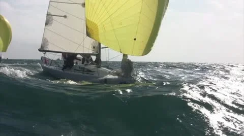 Sailboat surfing down the waves Stock Footage 10747670