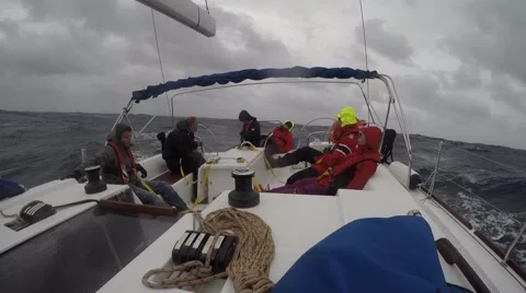 Sailboat team moving through storm Video stock 67668096