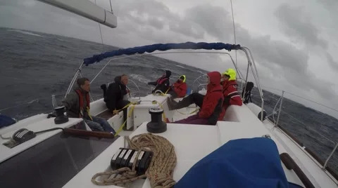 Sailboat team moving through storm Video stock 67668146