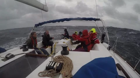 Sailboat team moving through storm Video stock 67668175