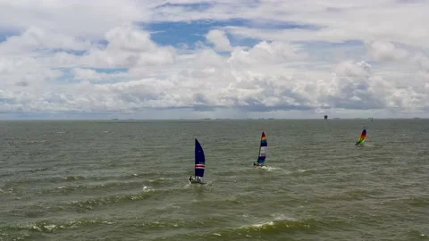 A sailboat turns over mid race Video stock 205082389