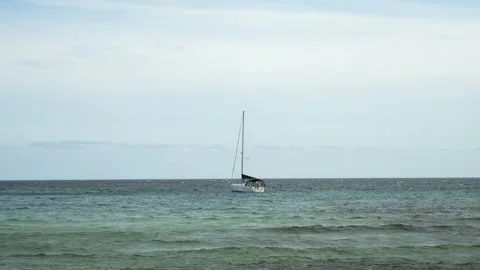 Sailboat in a typical cala of Menorca in a windy day, Minorca, Balearic Islands Stock Footage 303752702