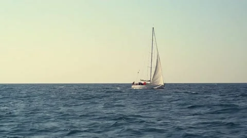 Sailboat under white sails at the regatta. Sailing yacht race. Stock Footage 155396544