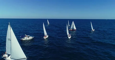 Sailboat under white sails at the regatta. Sailing yacht race. Stock Footage 155404207