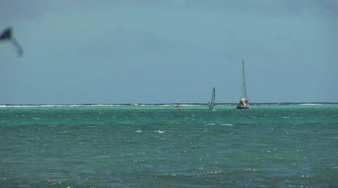 Sailboat &amp; windsurfer Stock Footage 90767