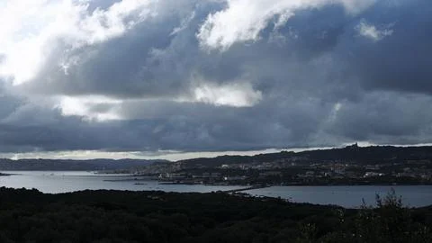 Sailboats and dramatic clouds, evening in the Mediterranean sea, La Maddale.. Foto stock