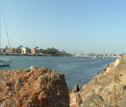 SailBoats Behind Rocks Stock Footage 46520359