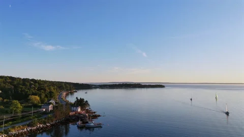 Sailboats in a cove at sunset Stock Footage 342951976