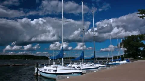 Sailboats docked at park marina Stock Footage