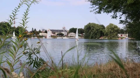 Sailboats float on the lake. Stock Footage 138138562