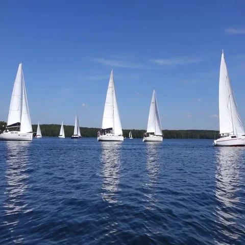 Sailboats floating on blue water summer. Stock Footage