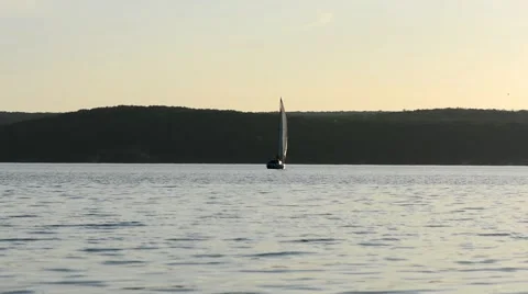 Sailboats go under white sails on the blue river Stock-Footage 69073883
