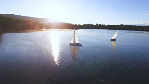 Sailboats sailing in a sunset Stockbeeldmateriaal 93089922