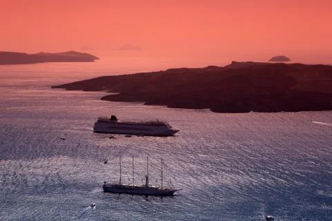 Sailing after sunset. fira, santorini. Stock Photos
