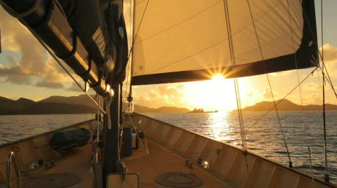 Sailing against the sun Stock Footage