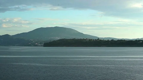 Sailing along the island Stock Footage 97525655