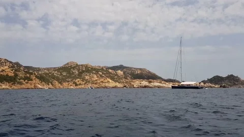 Sailing along rocky coast Stock Footage 167306403