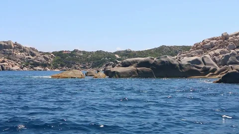 Sailing alongside beautiful cliffs with a thousand shapes Stock Footage 128930801
