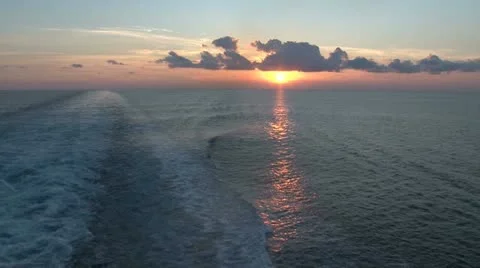 Sailing away from a distant sunset in Corfu Stock Footage 11192032