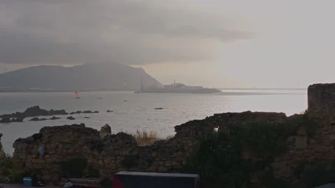 Sailing in a bay with coastal ruins in Basque Country Vídeos de archivo 341840102
