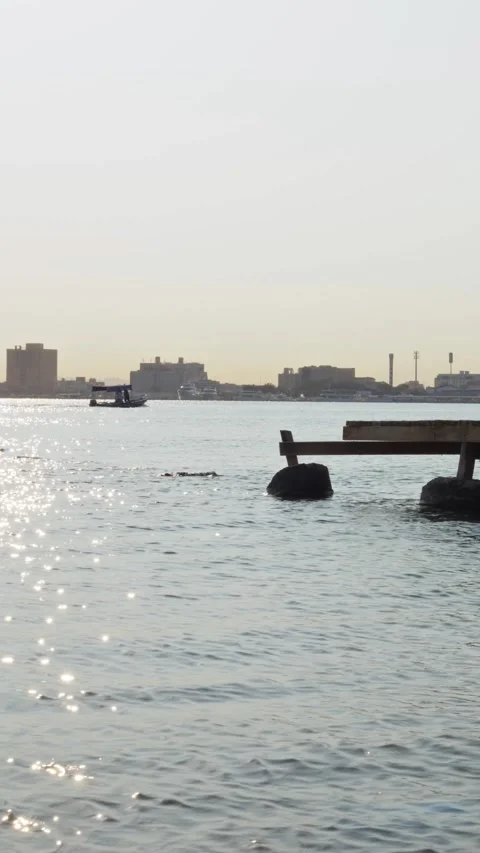 Sailing Boat and Sun Reflection on Jeddah Sea - 4k Vertical Video stock 327306838