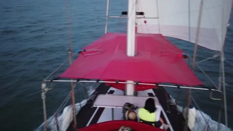 Sailing boat on the background of the water surface and the Crimean bridge Video stock 203806565