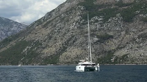 Sailing boat in a bay surrounded by mountains. Stock Footage 249086181