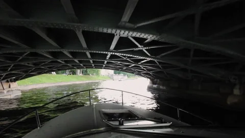 Sailing on a boat in a city river in summer. Passenger touristic yacht. 動画素材 235390053