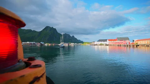 Sailing boat exiting the ferry terminal in Svolvær, Stock-Footage 312736476