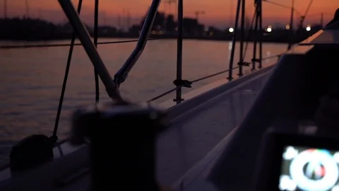 Sailing boat getting close to marina at sunset, view from cockpit Video stock 120421904