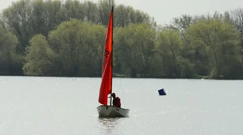 Sailing a boat on a lake Stock Footage 10898904