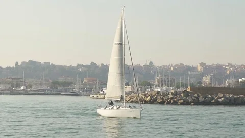 Sailing boat leaving the harbor 스톡 동영상 73288014
