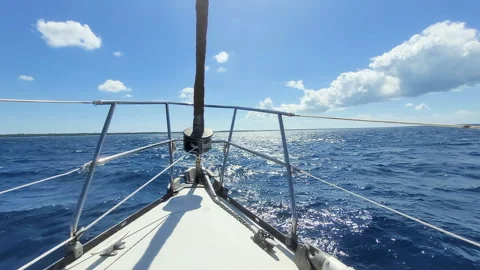 Sailing boat navigate over deep blue ocean water, pacefull jurney summer season. Stock Footage 244976095