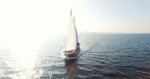 Sailing boat navigating with open sails in the sea Stock Footage 84940225