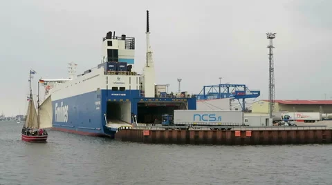 Sailing boat passing by big Stenaline ferry in harbor of Rostock 스톡 동영상 67573868