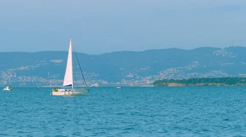 Sailing boat passing by Stock Footage 68086575
