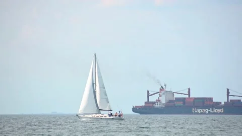Sailing boat passing by in the foreground and Charleston Express Stock Footage 158493915