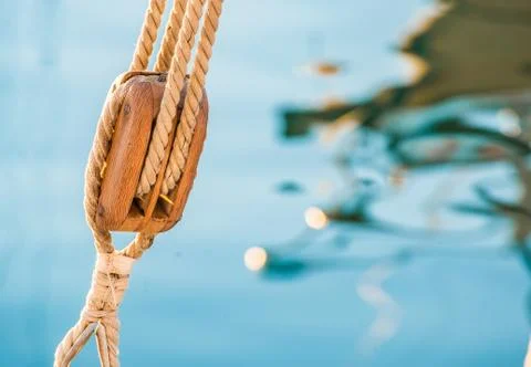 Sailing boat pulley, block and tackle with moored nautical rope Stock Photos