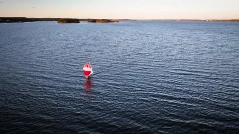 Sailing boat  in the rays of the setting sun sails. Stock Footage 287034625