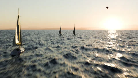 Sailing boat at sea at sunset. 3d animation of the sea with sailboats at sunset Stock Footage 339470982